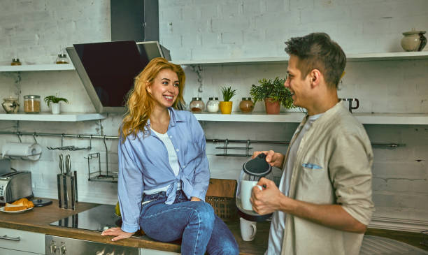 istock Romantic young couple cooking together in the kitchen, having a great time together. 1163894504