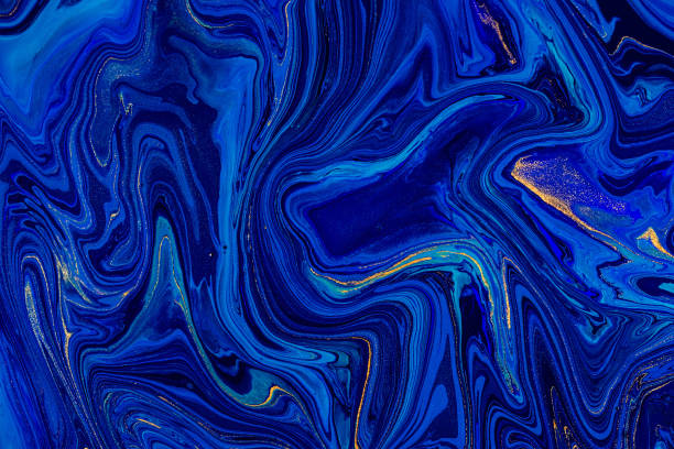 Hand painted background with mixed liquid blue and golden paints. Abstract fluid acrylic painting. Modern art. Marbled blue abstract background. Liquid marble pattern