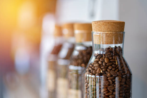 coffee beans in the glass bottle at cafe.
