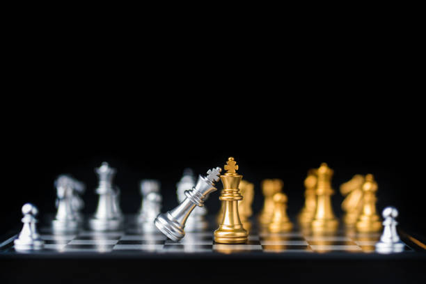 istock chess board game in competition play, Ideas business success concept 1163895287
