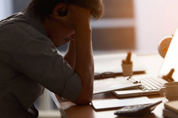 istock Young men feel stressed, tired business laptop computers in the Office. 1163899544