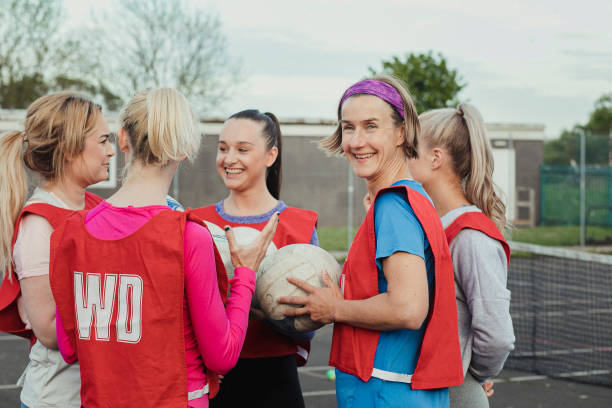 istock All Female Netball Team Chat Before The Game 1163901412