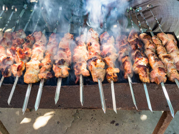 istock cooking many shish kebabs on brazier outdoors 1163902533
