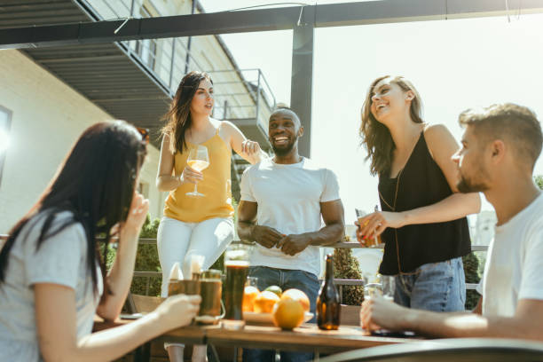 istock Young group of friends drinking beer and celebrating together 1163902575