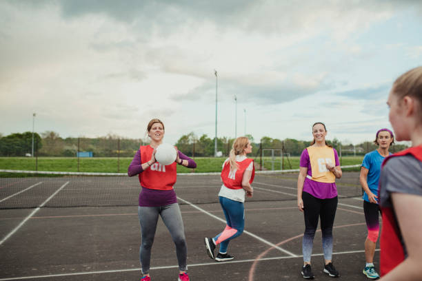 istock Friends Warming Up Before A Game Of Netball 1163902851