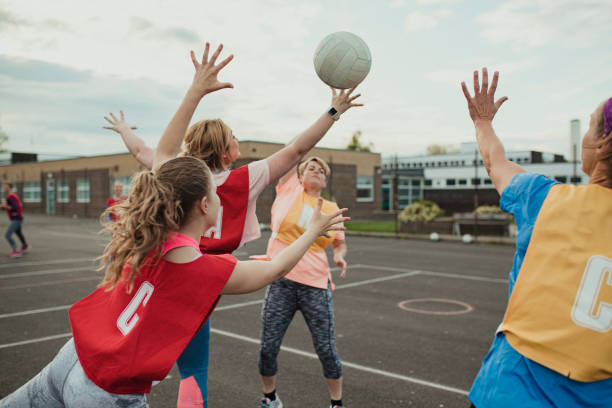 istock Friends Playing A Game Of Netball 1163903147