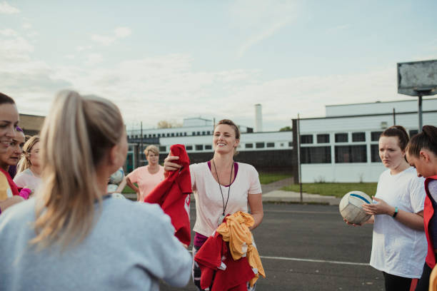 Handing Out Netball Bibs Before The Game