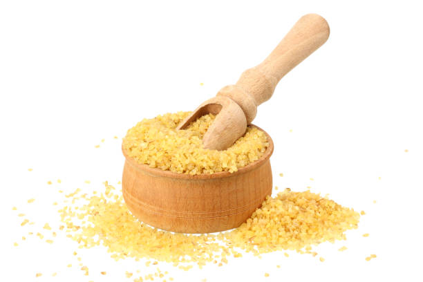istock dry bulgur wheat in wooden bowl isolated on white background 1163903303
