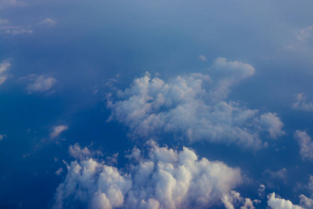 istock Aerial view sunset sky above clouds with dramatic light. View from airplane 1163903441