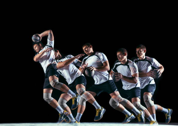 istock Young handball player against dark studio background in strobe light 1163905201