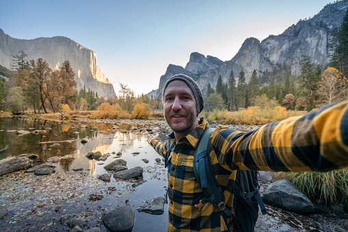 Young man taking selfie in Yosemite valley- hiking man