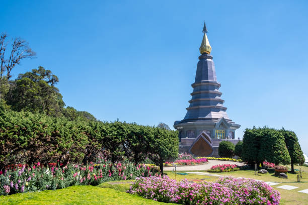 The iconic hot-spots view of Phra Maha Dhatu Nabhapolbhumisiri or The Great Holy Relics Pagoda Nabhapolbhumisiri with the beautiful flower garden at Doi Inthanon National Park, Chiang Mai. stock photo