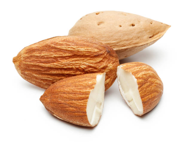 istock Group of almonds isolated on white 1163908734