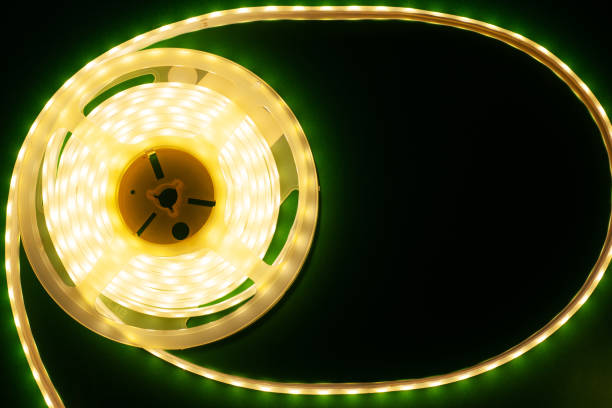 istock Luminous LED strip on a illuminated dark green background mockup top view 1163908770