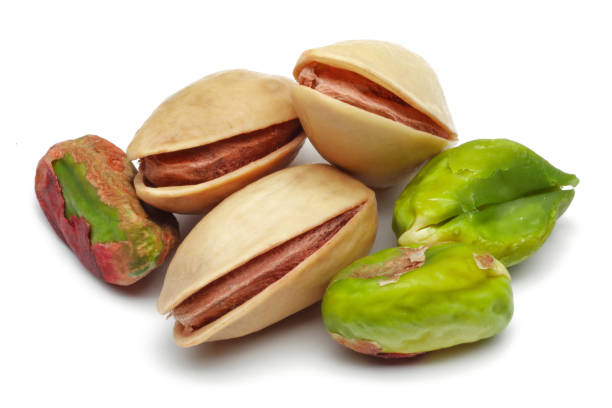 istock Group of pistachio nuts isolated on white 1163909003