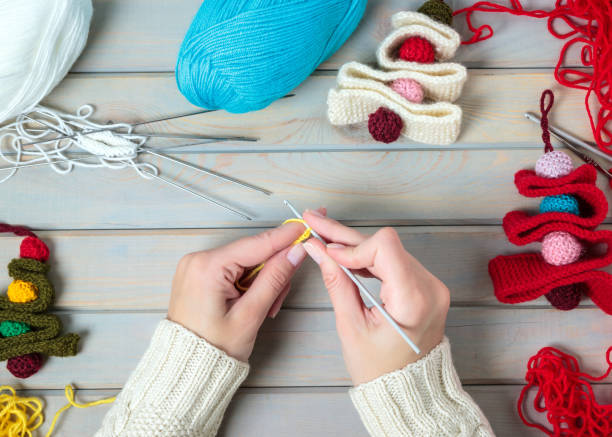 istock Knitting. Hand Crochet.  Female hand knit hook. 1163909004