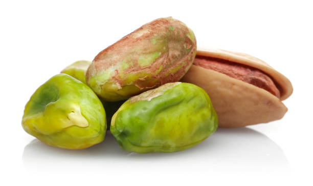 istock Group of pistachio nuts isolated on white 1163909195