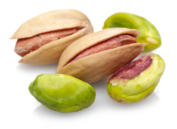 istock Group of pistachio nuts isolated on white 1163909393