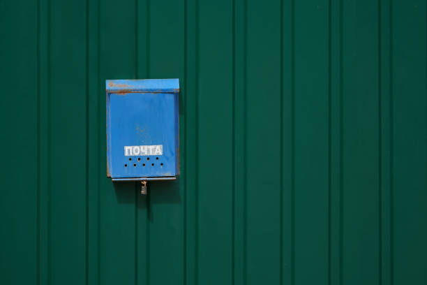 istock Old rusty russian mailbox on the metal wall 1163911815