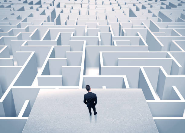 istock Businessman staring at infinite maze 1163912012