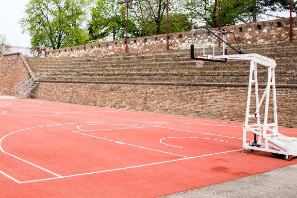 istock Basketball court by a brick wall background 1163912905