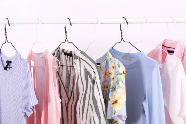 istock Different colorful casual clothing hanging in row. 1163913699