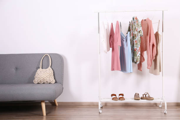 istock Different colorful casual clothing hanging in row. 1163913701