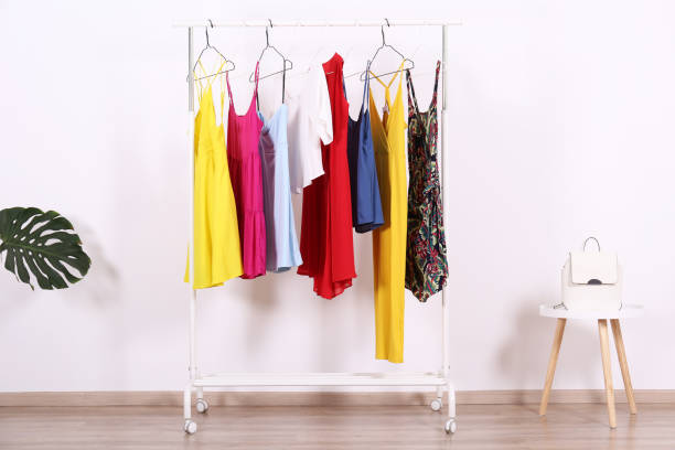 istock Different colorful casual clothing hanging in row. 1163913704