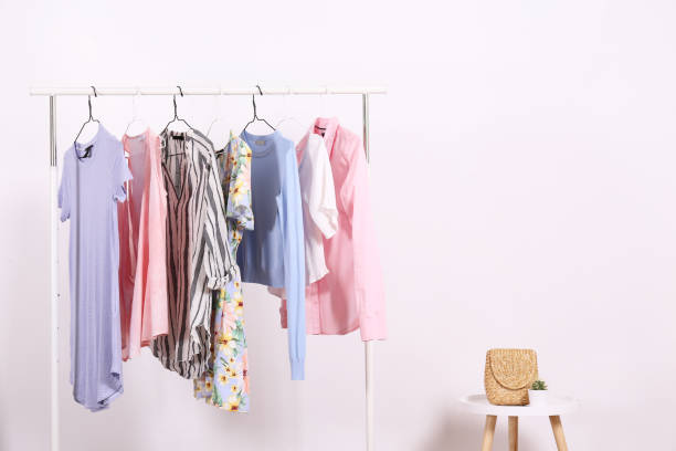 istock Different colorful casual clothing hanging in row. 1163913709