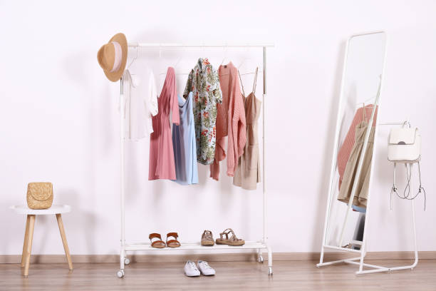 istock Different colorful casual clothing hanging in row. 1163913723