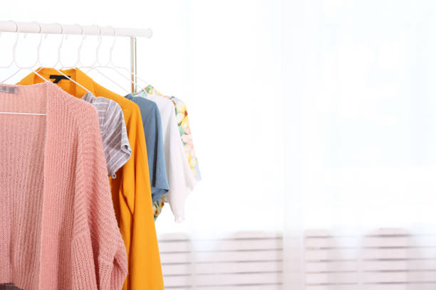 istock Different colorful casual clothing hanging in row. 1163913771