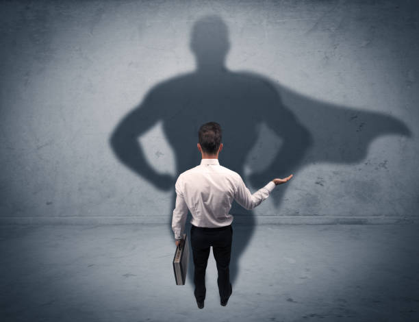 istock Successful businessman with superhero shadow 1163913796