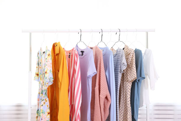 istock Different colorful casual clothing hanging in row. 1163913824