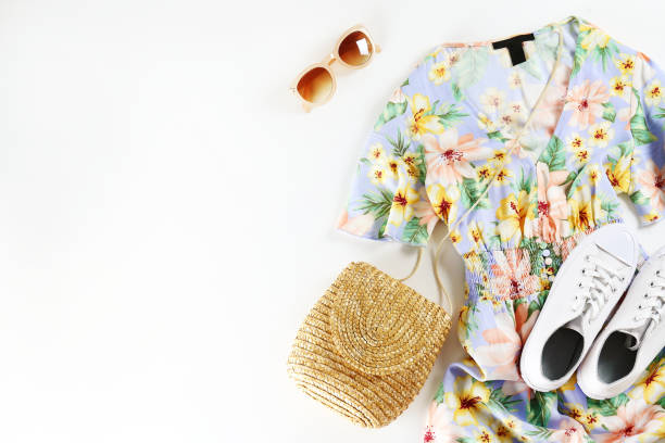 Fashionable clothing set lying on white background.