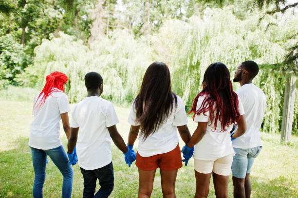 istock Group of happy african volunteers 1163917004