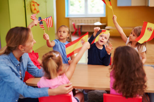 istock Group of  children learning languages during lessons in the school 1163918116