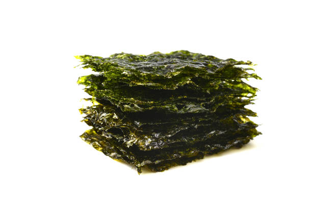 Nori seaweed isolated on white. Nori seaweed isolated on white. nori stock pictures, royalty-free photos & images