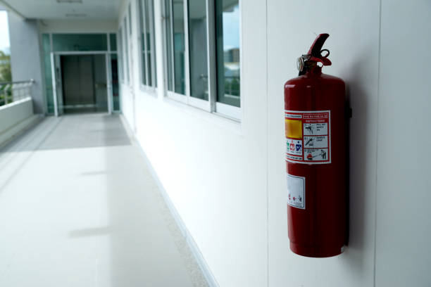 istock Fire extinguisher install front of the room. Security system concept. 1163921720