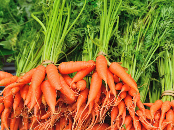 istock fresh baby carrot with leaf 1163922536