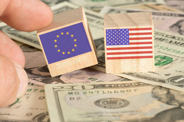 istock Dollar banknotes and flags of EU and USA 1163922828