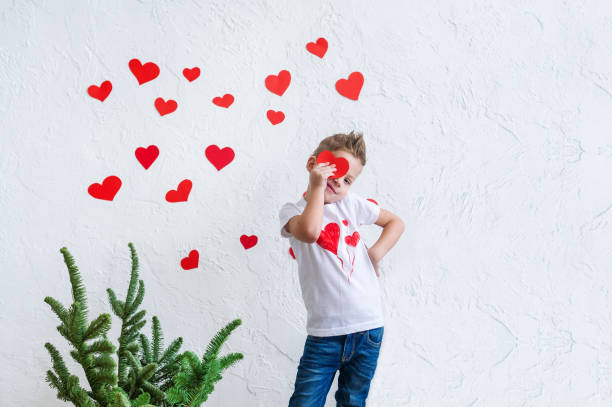 istock Portrait of a boy with hearts on face. 1163923096