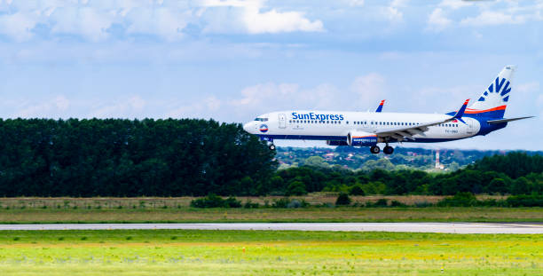 SunExpress Airline Boeing 737 Budapest Hungary Aug 14, 2019: SunExpress Airline Boeing 737 TC-SNO just landing at Budapest International airport. sunexpress stock pictures, royalty-free photos & images