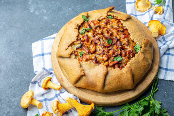 istock Homemade pie with wild chanterelles and potatoes. 1163924473