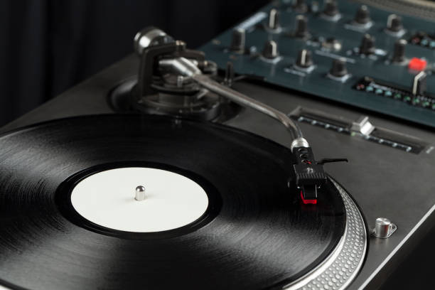 istock Turntable playing vinyl close up with needle on the record 1163926703