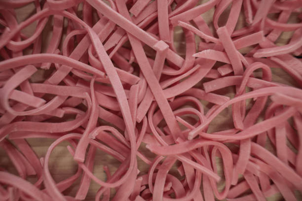 istock Home tomatoes red noodles on a wooden table background. 1163928590