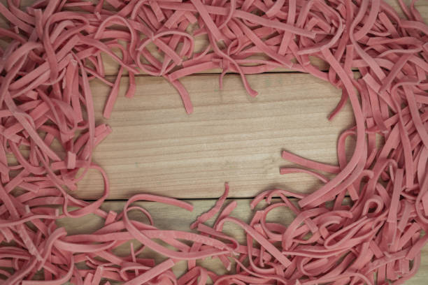 istock Home tomatoes red noodles on a wooden table background. 1163928777