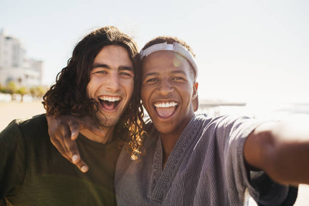 istock Cheerful friends making a selfie outdoors 1163929072