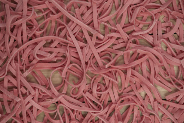 istock Home tomatoes red noodles on a wooden table background. 1163929129