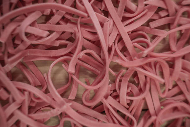 istock Home tomatoes red noodles on a wooden table background. 1163929372
