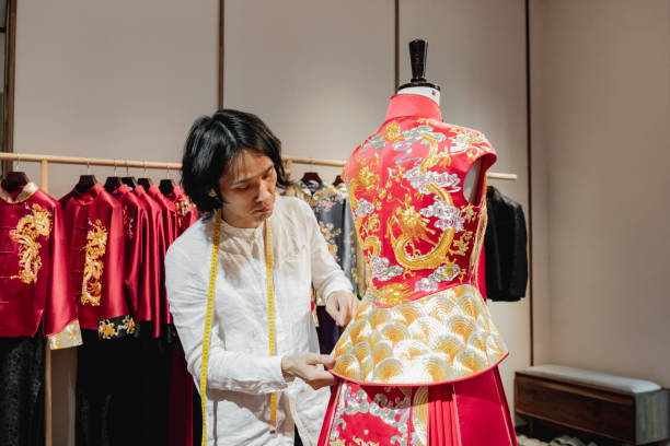 Chinese wedding dress designer working on a fine garment
